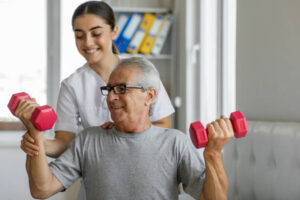 Nurse and male patient exercising